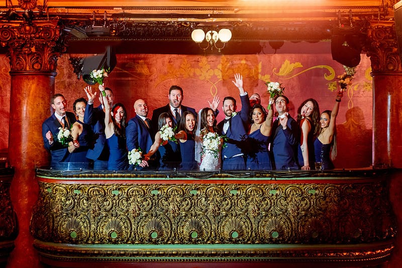 Bridal party celebrating from the upper balcony at the Great American Music Hall.
